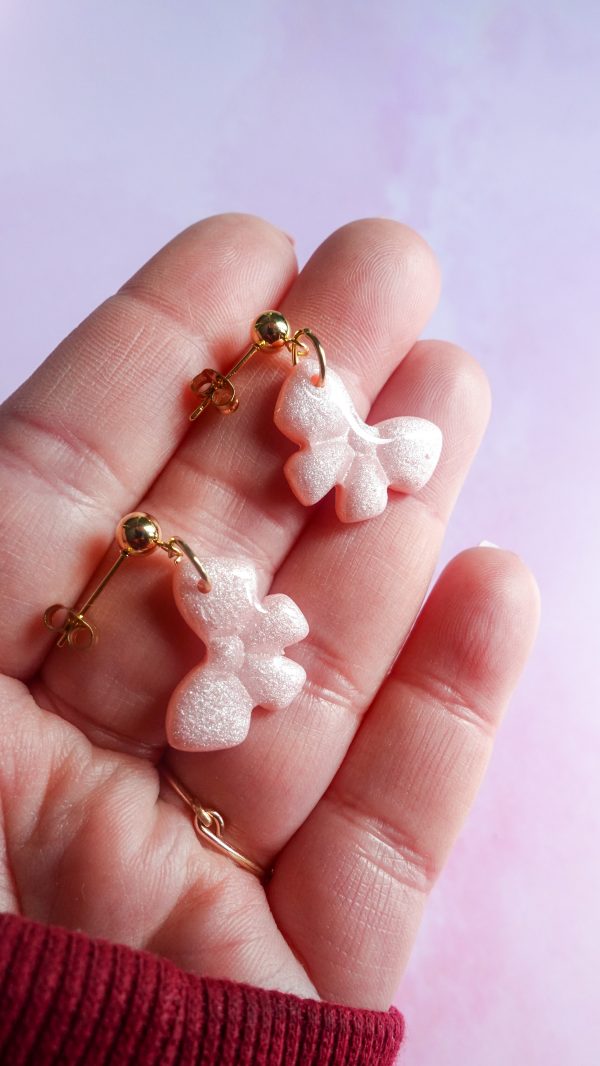 Boucles d'oreilles nœud rose
